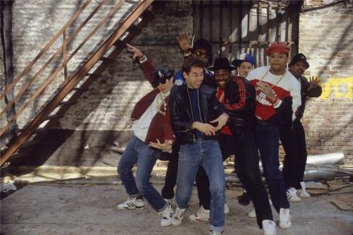 beastie boys run dmc in alley under fire escape brick wall